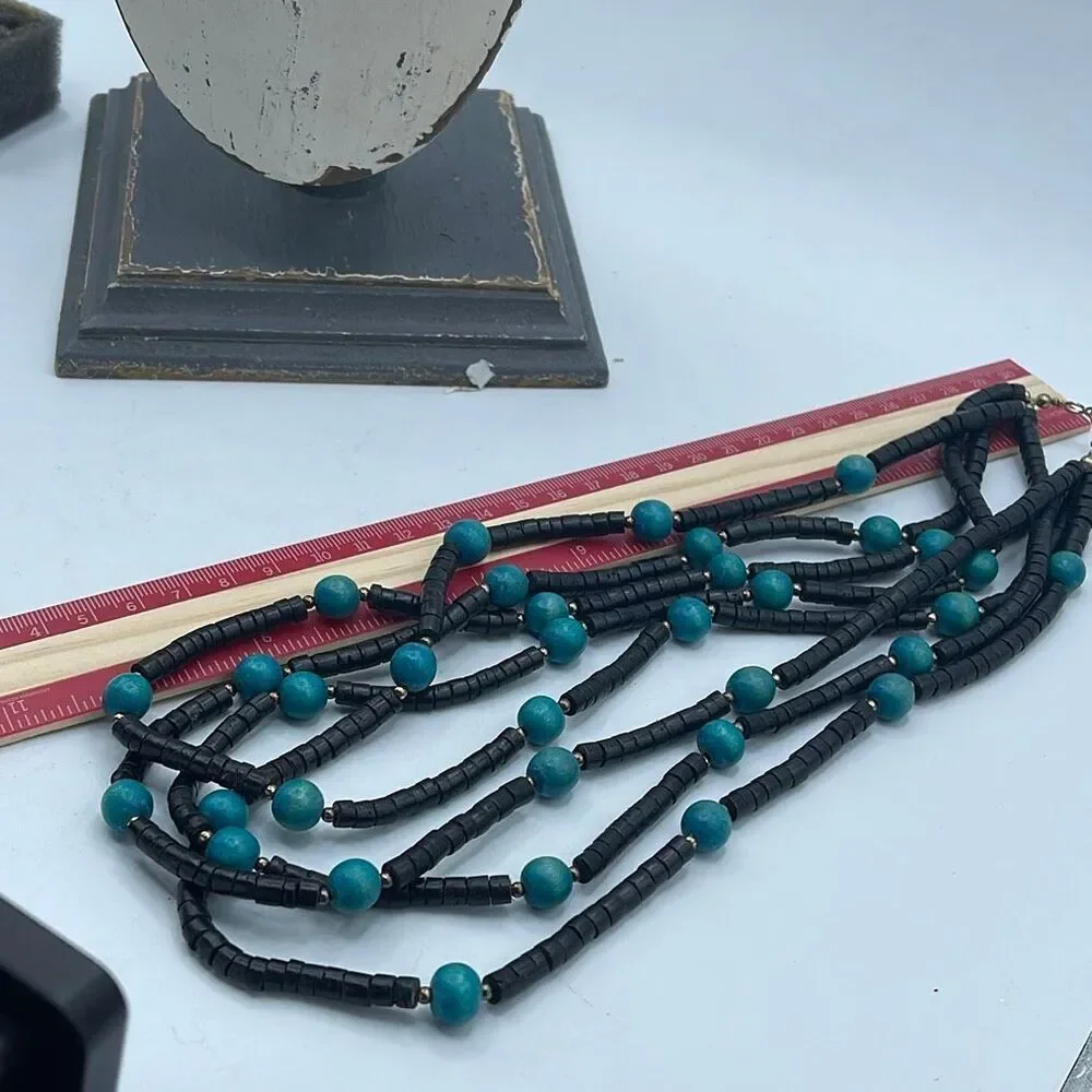 Vintage 4 strand wooden beaded boho festival necklace.